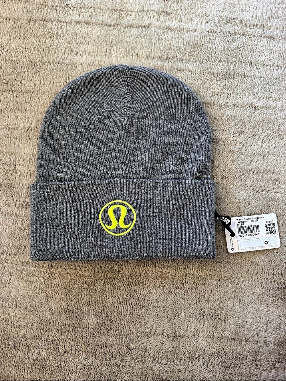 lululemon Warm Revelation Beanie in heathered gray with highlight yellow logo.